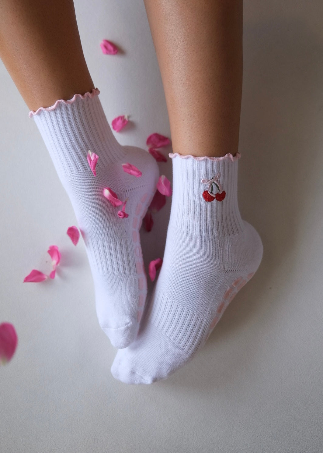 White grip socks with cherry embroidery and cute pink frillies/grips
